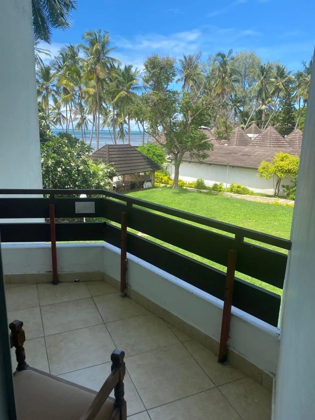 View from a guest balcony over the gardens to the ocean — Kenya Bay Beach Hotel, Bamburi Beach Mombasa