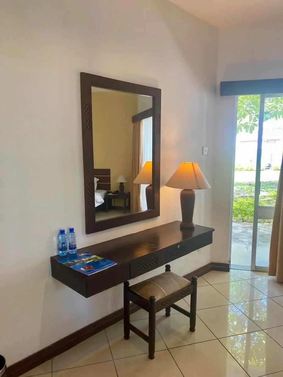 Dressing area with mirror and garden doors — Kenya Bay Beach Hotel, Bamburi Beach Mombasa