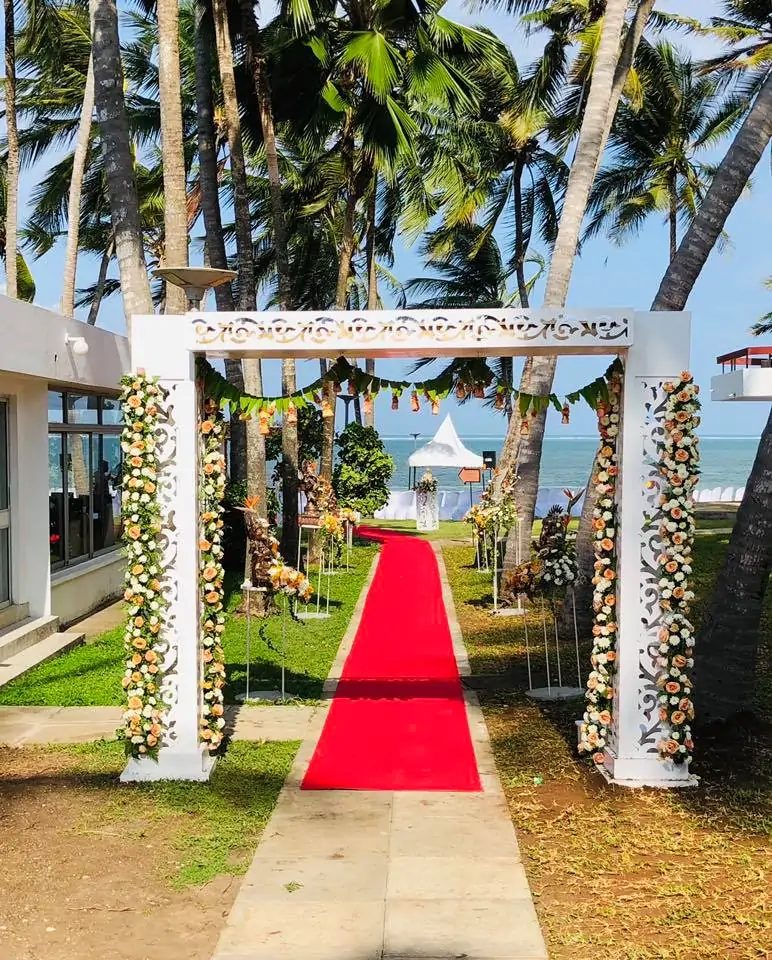 Floral arch and aisle leading to the beach — Kenya Bay Beach Hotel, Bamburi Beach Mombasa